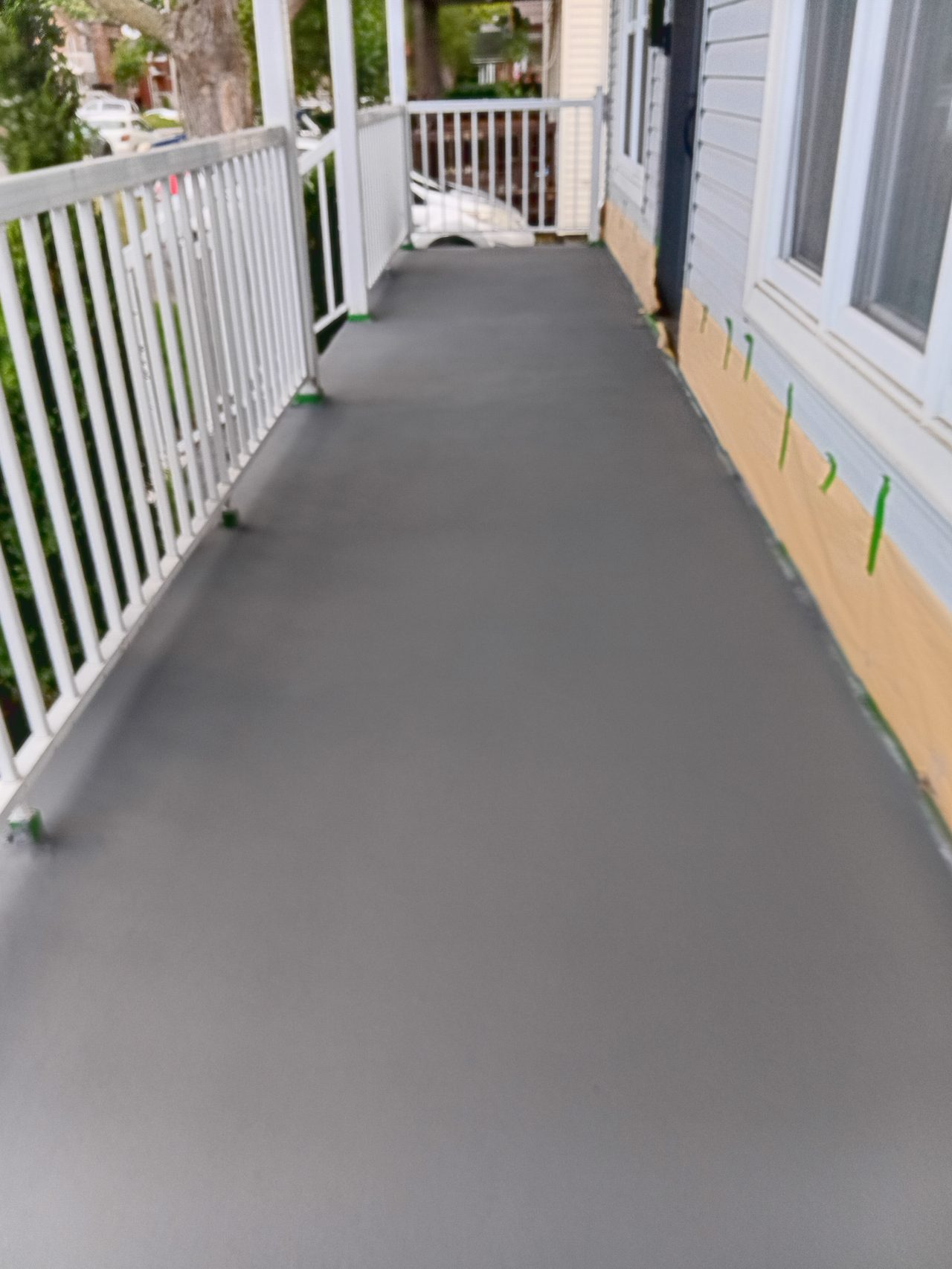 Concrete walkway along a porch
