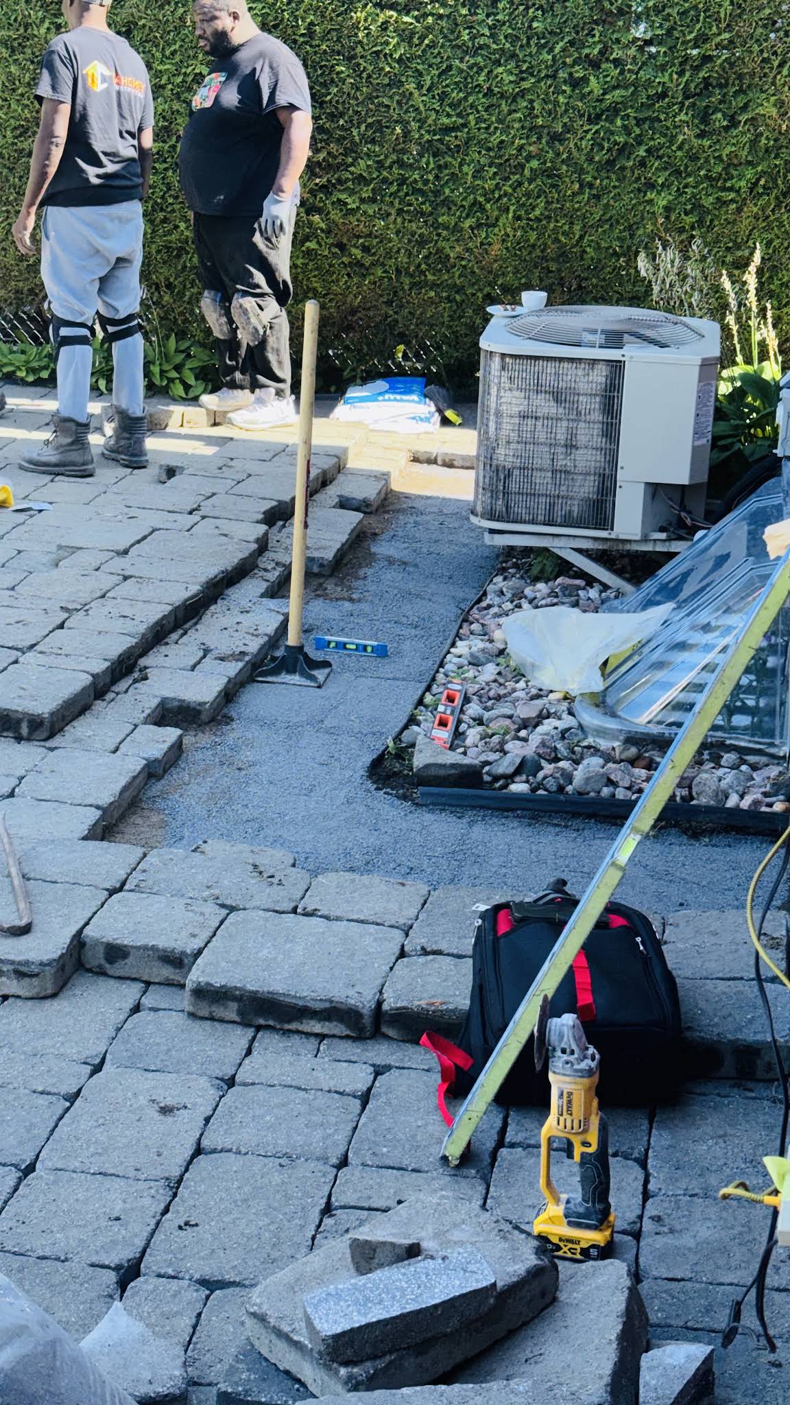 Paving stone work in progress in a backyard